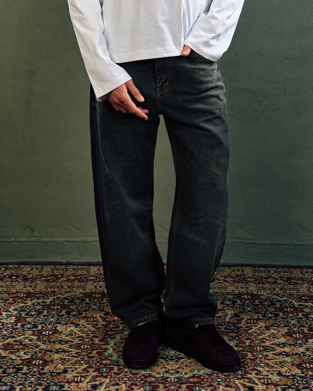Relaxed Fit Jeans In Faded Black, front leg view